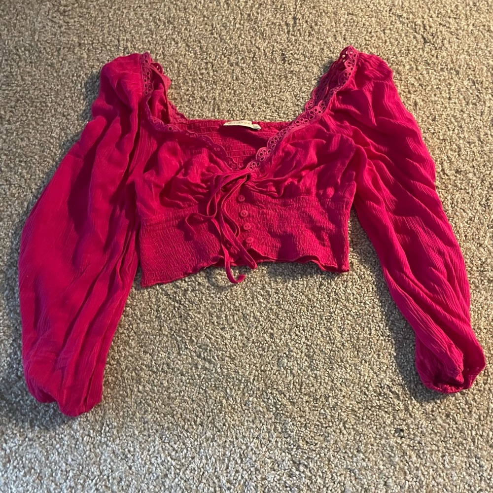 Pink cropped long sleeve top